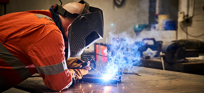 Engineer working with a soldering iron