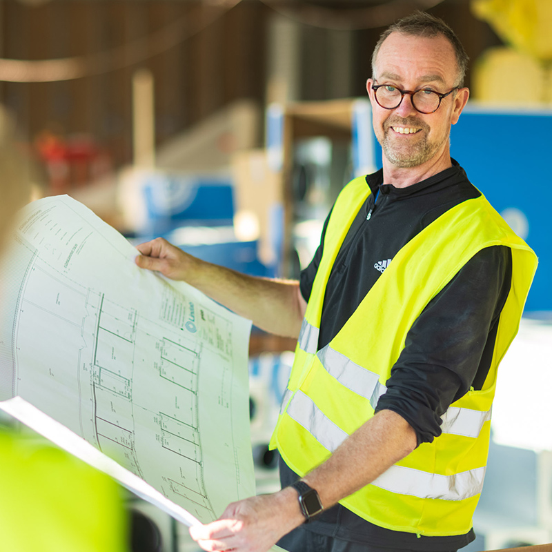 Man looking at building plans