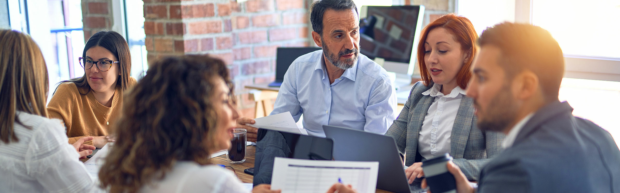Leadership team around a meeting table