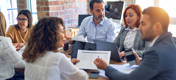 Leadership team around a meeting table
