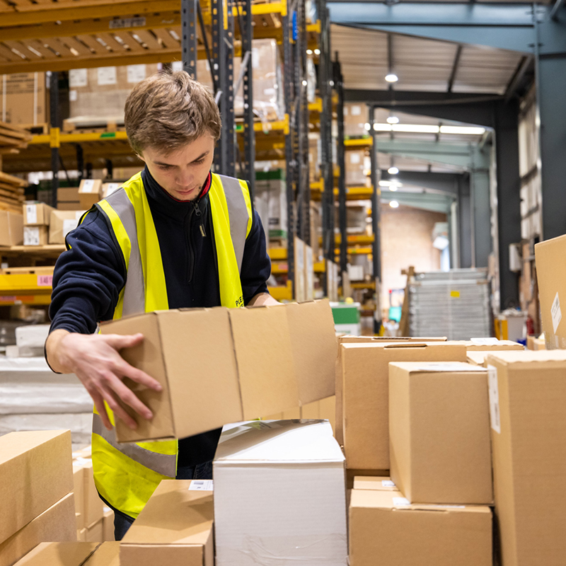 Person managing stock in a warehouse
