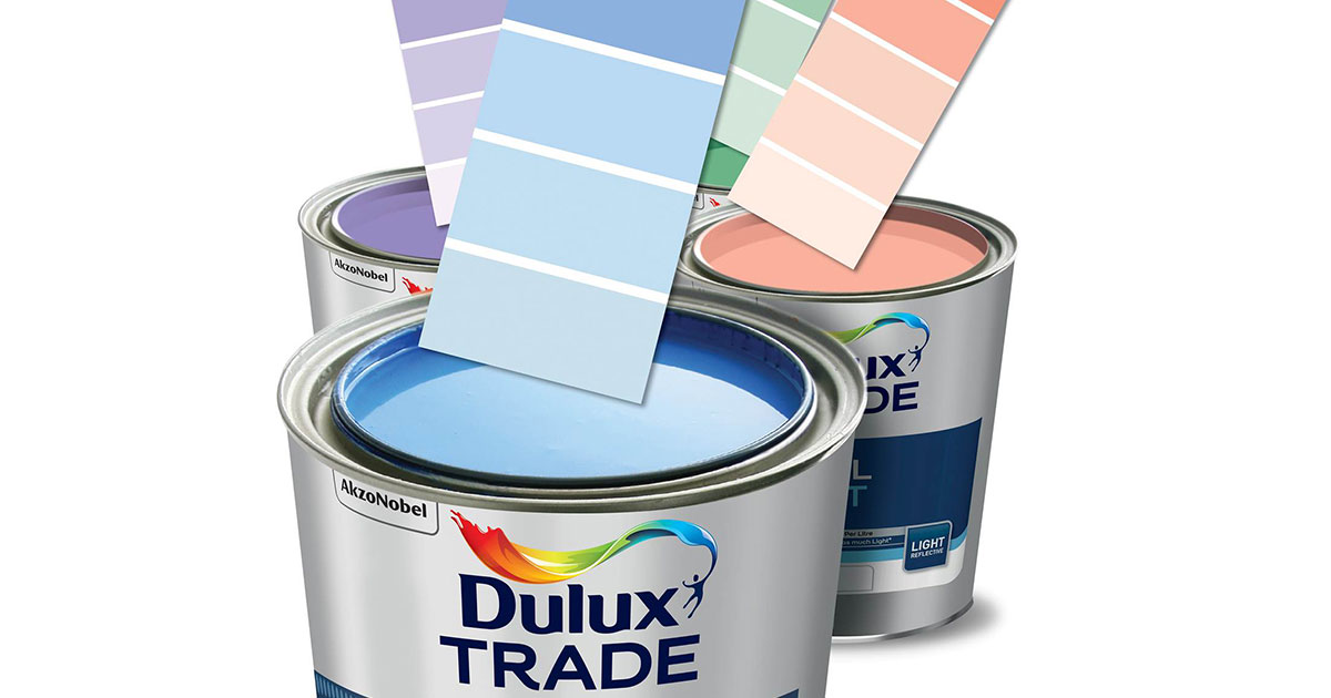 Tins of Dulux Paint with colour cards