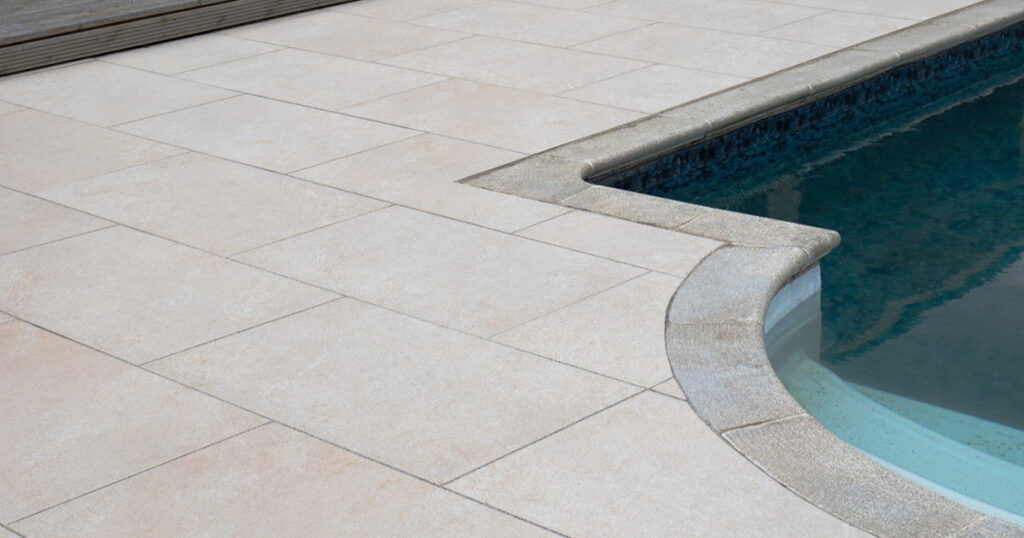Tiles surrounding a swimming pool